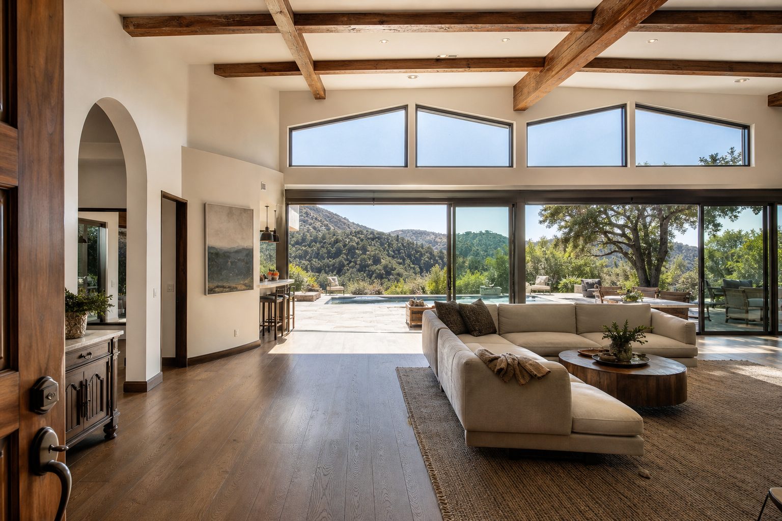 Bright hillside estate with pool, high ceilings, and views toward Santa Monica Mountains in Woodland Hills.