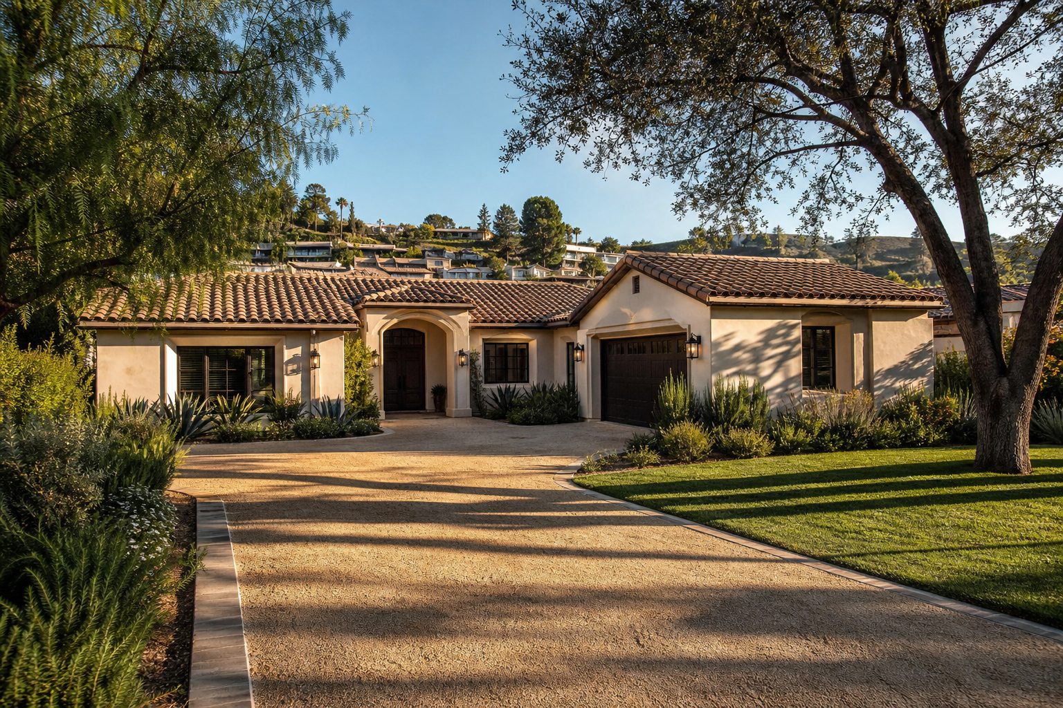 Classic stucco home with mature trees and manicured lawn in Woodland Hills south of Ventura Boulevard.